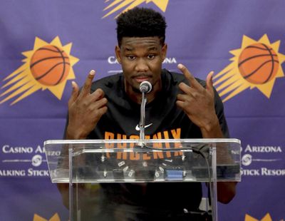 Deandre Ayton, who may be the Phoenix Suns’ choice with the No. 1 overall pick in this month’s NBA draft, talks to the media after an individual workout with the Suns on June 6 in Phoenix. (Matt York / AP)