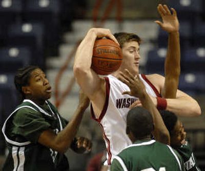 
 Washington State's Aron Baynes grabs a rebound against Mississippi Valley State's Orlando Smith, left. Baynes had 4 points, 9 boards. Associated Press
 (Ingrid Barrentine Associated Press / The Spokesman-Review)