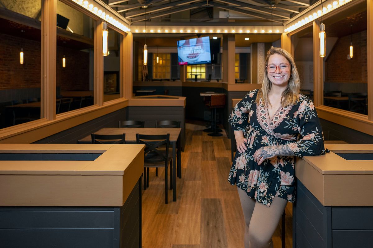 Hillary Yarno, co-owner of The New 63 Social House & Eatery, poses for photo in the restaurant that has just opened in the space formerly occupied by Rocky Rococo in downtown Spokane.  (COLIN MULVANY/The Spokesman-Review)