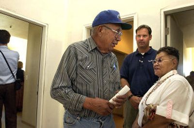 
Coeur d'Alene tribal elder Felix Aripa, left, chats with elder Geraldine Sherwood, right, about their impressions of the new elder housing in Plummer on Thursday during the grand opening. Listening between them is builder Rob Gross of Cornerstone Construction. 
 (Jesse Tinsley / The Spokesman-Review)