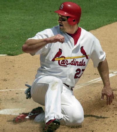 
St. Louis third baseman Scott Rolen will try to heal his ailing shoulder with rest. 
 (Associated Press / The Spokesman-Review)