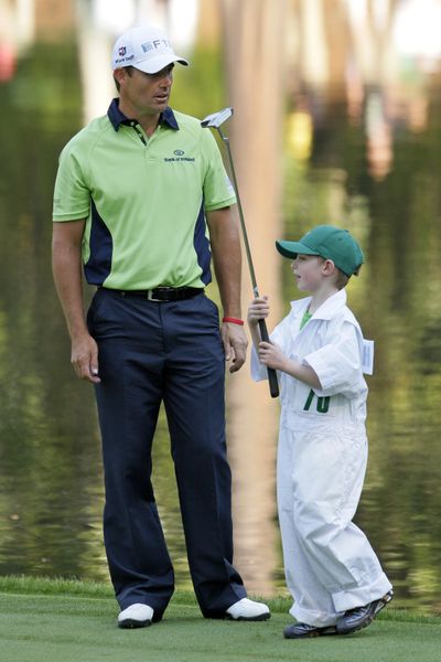 Padraig Harrington waits to putt with his son, Patrick, during Wednesday’s Par 3 contest.  (Associated Press / The Spokesman-Review)