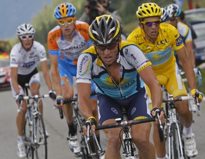 Lance Armstrong, center, sets the pace for his teammate and overall leader Alberto Contador, right, as they climb Petit-Saint-Bernard pass during the 16th stage. (Associated Press / The Spokesman-Review)