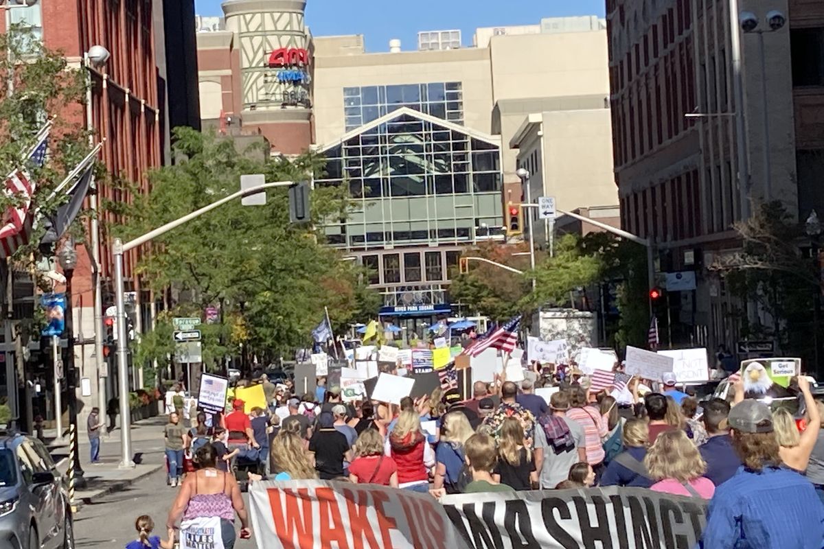 Protestors from the "Rally for Medical Freedom" against coronavirus mandates head toward River Park Square Saturday in downtown Spokane.   (John Stucke/THE SPOKESMAN-REVIEW)