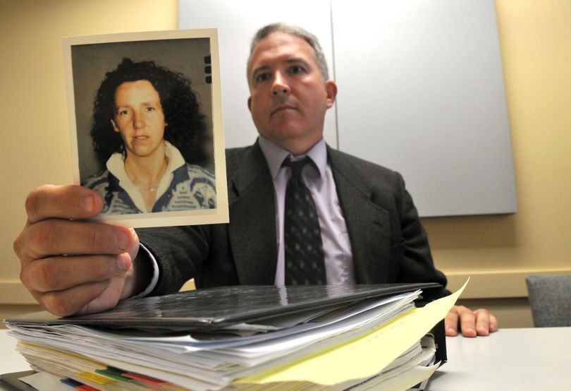 Detective Mark Burbridge holds a photo of Michaelle Champagne, reported missing in the early 1990s. Burbridge hopes some memories are jogged by his current work and that he can get new information on what happened to her. (Jesse Tinsley)