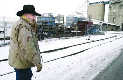 
Royce Lynch, a dispatcher for Huber and Son Trucking,  shows Wednesday where he followed footprints after a theft the previous weekend. Someone stole more than 300 pounds of extension cords used to heat the engines of semitrucks at the company near Desmet Avenue and Long Road in Spokane Valley. 
 (Photos by J. Bart Rayniak / The Spokesman-Review)