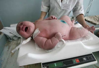 
Newly born Nadezhda Khalina gets weighed on Wednesday.S
 (The Spokesman-Review)