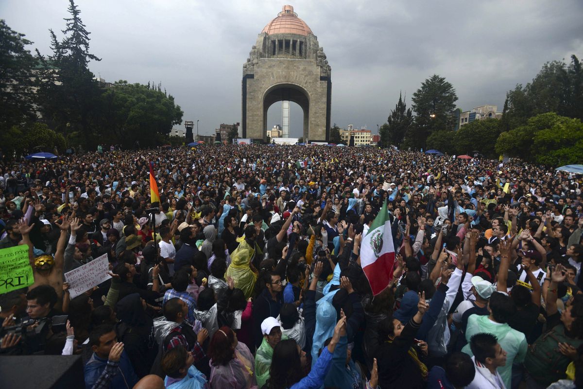 Thousands of people gather in front of the Monument of the Revolution in Mexico City on Monday, a day after national elections. (Associated Press)