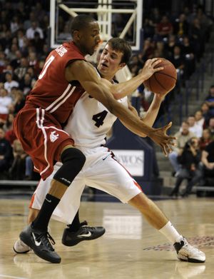 Washington State's Marcus Capers applies pressure to Gonzaga's Kevin Pangos, who tied a school record with nine 3-pointers in scoring a game-high 33 points in the Bulldogs’ 89-81 victory.