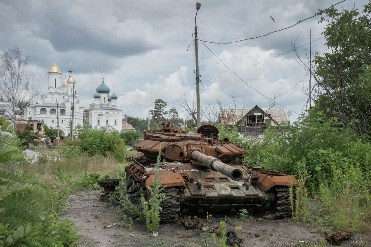 Vegetation grows around a Russian tank destroyed by Ukrainian forces late last year during a battle to retake the town of Sviatohirsk, in eastern Ukraine, on June 25, 2023. The Russian military still suffers from poor communication, coordination and leadership, but most of all, analysts say, from a morale-sapping lack of accountability.   (Mauricio Lima/The New York Times)
