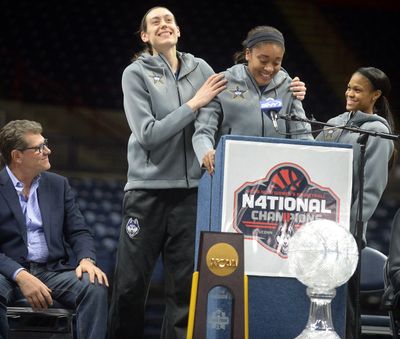 UConn seniors Breanna Stewart, left, Morgan Tuck, center, and Moriah Jefferson will celebrate their fourth straight championship indoors because of inclement weather. (Jim Michaud / Associated Press)