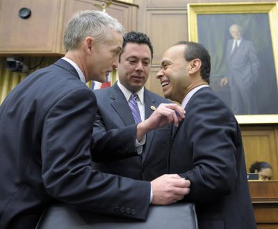 House Judiciary Committee member Rep. Jason Chaffetz, R-Utah, center, adjusts the flag pin on fellow committee member Rep. Luis Gutierrez, D-Ill., right, as they share a laugh with Rep. Trey Gowdy, R-S.C., on Capitol Hill in Washington, Tuesday, Feb. 5, 2013, prior to the committee's hearing on America's Immigration System: Opportunities for Legal Immigration and Enforcement of Laws against Illegal Immigration. (Susan Walsh / Associated Press)