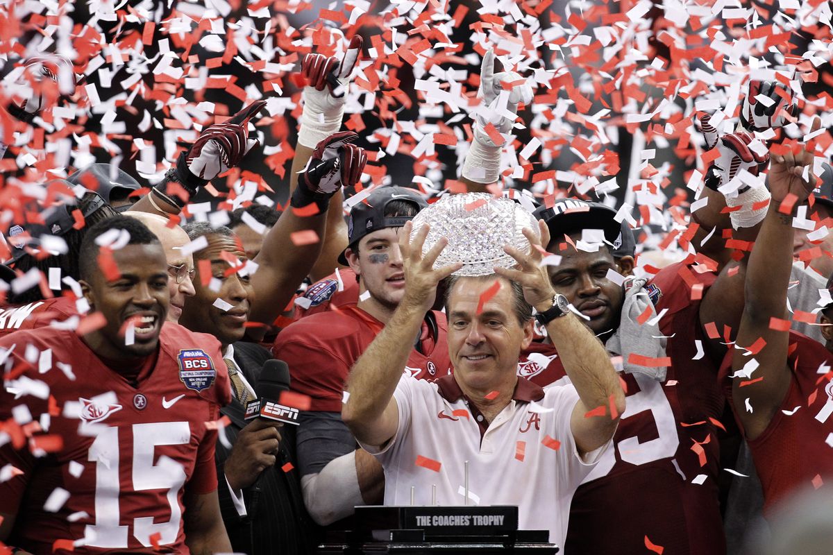 Alabama coach Nick Saban and his players celebrate after dominating LSU 21-0 in the BCS Championship game Monday night. (Associated Press)