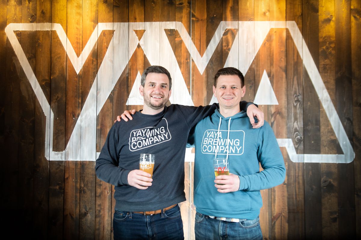 Brothers Jason and Chris Gass stand for a portrait in their taproom at YaYa Brewing Co. in Spokane Valley on Dec. 16. YaYa Brewing recently celebrated its first anniversary in business and is open for to-go orders at 11712 E. Montgomery Drive. (Libby Kamrowski/ THE SPOKESMAN-REVIEW)