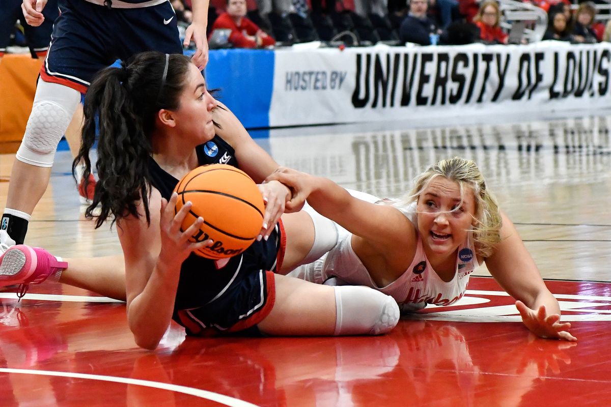 Gonzaga forward Melody Kempton (33), left, and Nebraska guard Whitney Brown (10) fight for a loose ball during the second half of their women