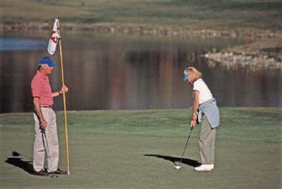 
By walking the course, instead of using a cart, you can get a decent workout. 
 (File photo / The Spokesman-Review)