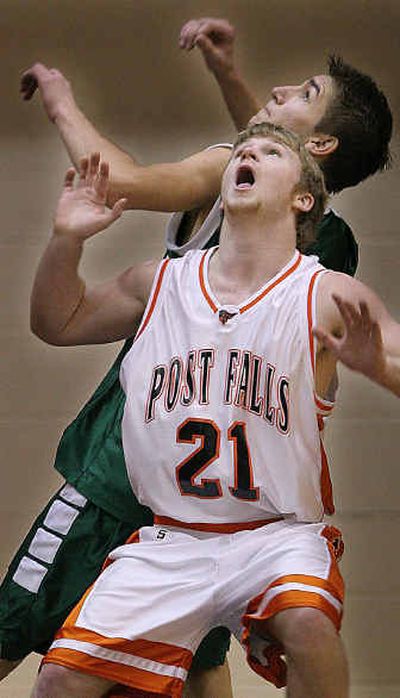 
Post Falls' Dan Hamilton (21) gets position against Bonneville's Jordan Keck in Saturday's fourth-place game at the State 4A tournament.
 (Matt Cilley/Special to The Spokeman-Review / The Spokesman-Review)