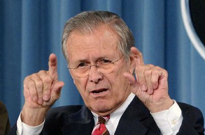 
Secretary of Defense Donald Rumsfeld answers a reporter's question during a news conference at the Pentagton. 
 (Associated Press / The Spokesman-Review)
