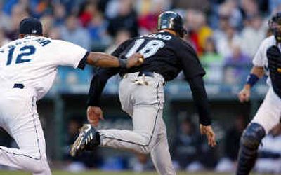 Seattle's Jolbert Cabrera tags out Toronto's Simon Pond. Seattle's Jolbert Cabrera tags out Toronto's Simon Pond.
(Associated Press / The Spokesman-Review)