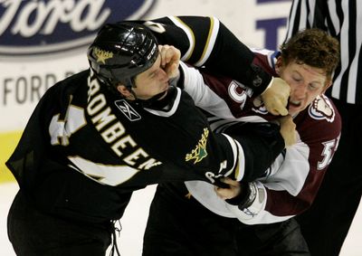 Dallas’ B.J. Crombeen, left, and Colorado’s Cody McLeod, right, exchange blows during their game in Dallas. The Avalanche beat the host Stars 5-4. (Associated Press / The Spokesman-Review)