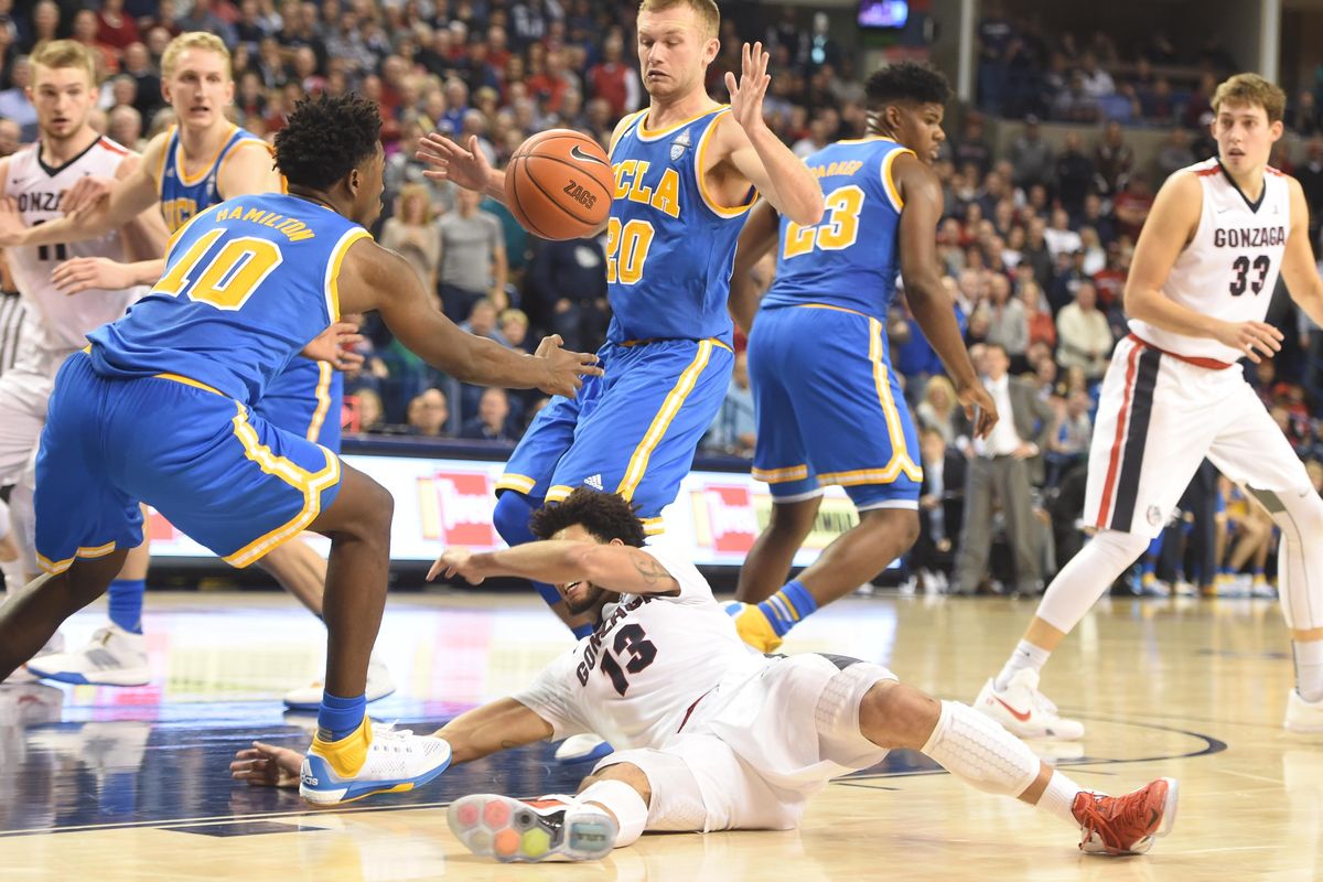 Gonzaga’s Josh Perkins loses his footing and the ball while surrounded by UCLA defenders as he drives to the hoop in the second half Saturday, Dec. 12, 2015 at McCarthey Athletic Center. UCLA edged the Zags 71-66. (Jesse Tinsley / The Spokesman-Review)