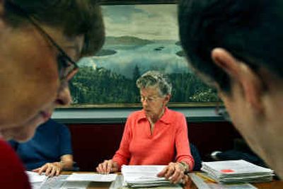 Jean Piehl, center, was hired along with Sally Transue, left, and Alice Nelson, right, to count the ballots in the building-height advisory election.
(Kathy Plonka / The Spokesman-Review)