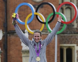 Gold medalist Kristin Armstrong, of the United States, celebrates after winning the women's individual time trial event at the 2012 Summer Olympics, Wednesday, Aug. 1, 2012, in London. (AP / Sergey Ponomarev)