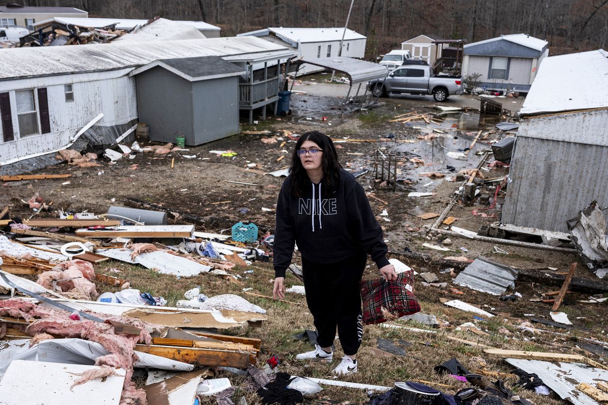 POPLAR BLUFF, MISSOURI - MARCH 15: Madison Woodard helps search for her mother's medicine near the destroyed trailer where Madison lived with her mother, Denise Woodard, on March 15, 2025 in Poplar Bluff, Missouri. Many homes throughout Harmony Hills were damaged by the severe weather on Friday night that left one person dead in Butler County, Missouri. At least 19 people have reportedly been killed after tornadoes and severe storms hit several midwest and southern states overnight. (Photo by Brad Vest/Getty Images)  (Brad Vest)