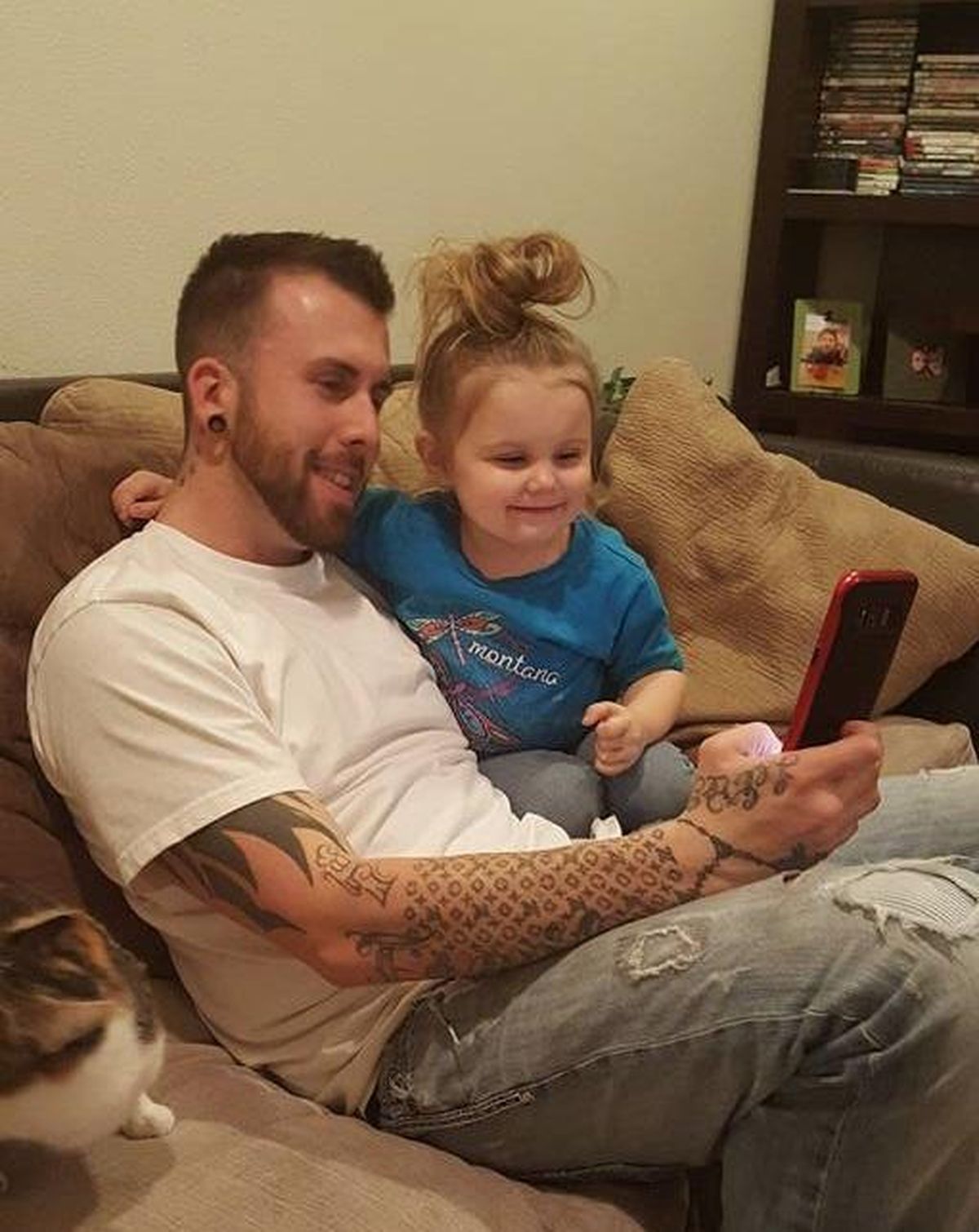 Derek Batton bonds with his fiancee’s daughter in a family photo. Batton, 34, died of an overdose in the Grant County Jail in Ephrata, Washington, on Sunday, Aug. 12, 2018. (Courtesy of Tiffany Hagadorn)