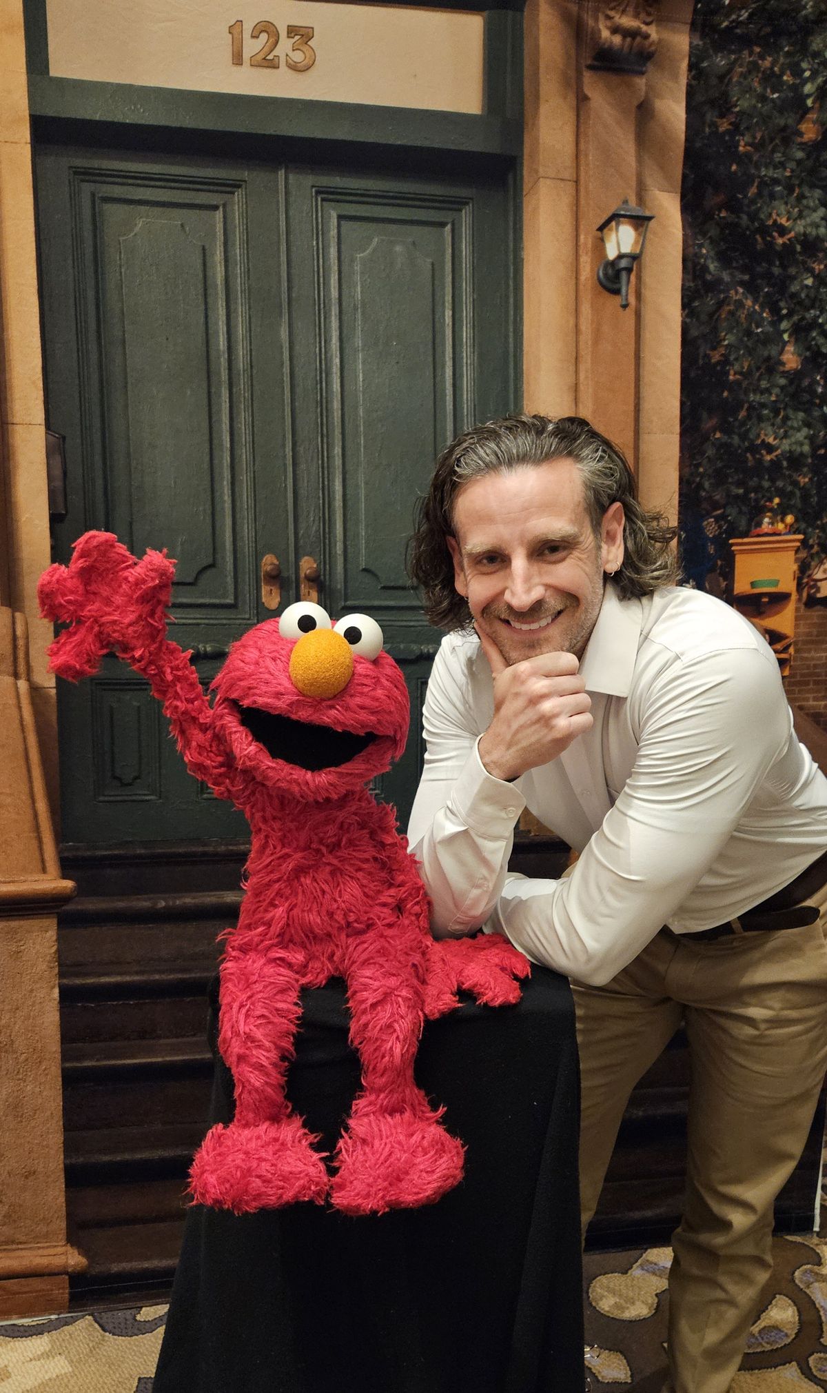 KSPS-PBS president and general manager Skyler Reep poses with “Sesame Street’s” Elmo.  (Courtesy)