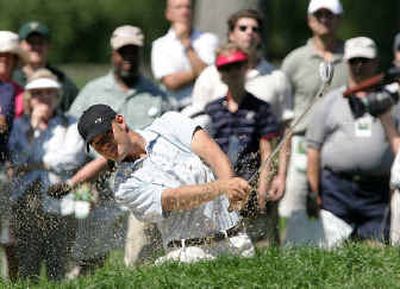 
Ryan Moore, of Puyallup, Wash., hits out of the bunker during last year's U.S. Amateur Championship at Winged Foot. 
 (Associated Press / The Spokesman-Review)