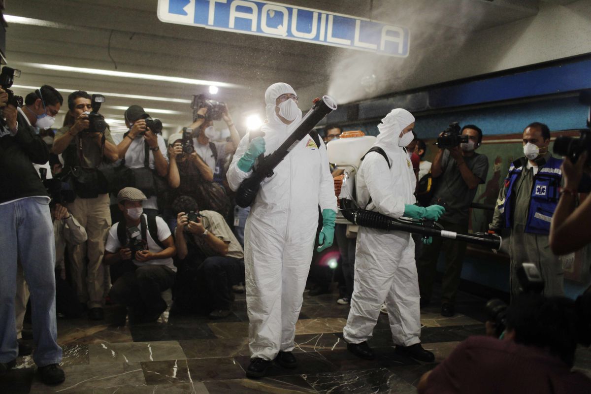 Health workers fumigate against the swine flu at a subway station in Mexico City, on Saturday. Mexico reported no new deaths overnight, but the virus keeps spreading around the world. Associated Press photos (Associated Press photos / The Spokesman-Review)