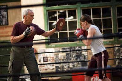 
 Actor-director Clint Eastwood, left, as Frankie and actress Hilary Swank as Maggie in a scene from 