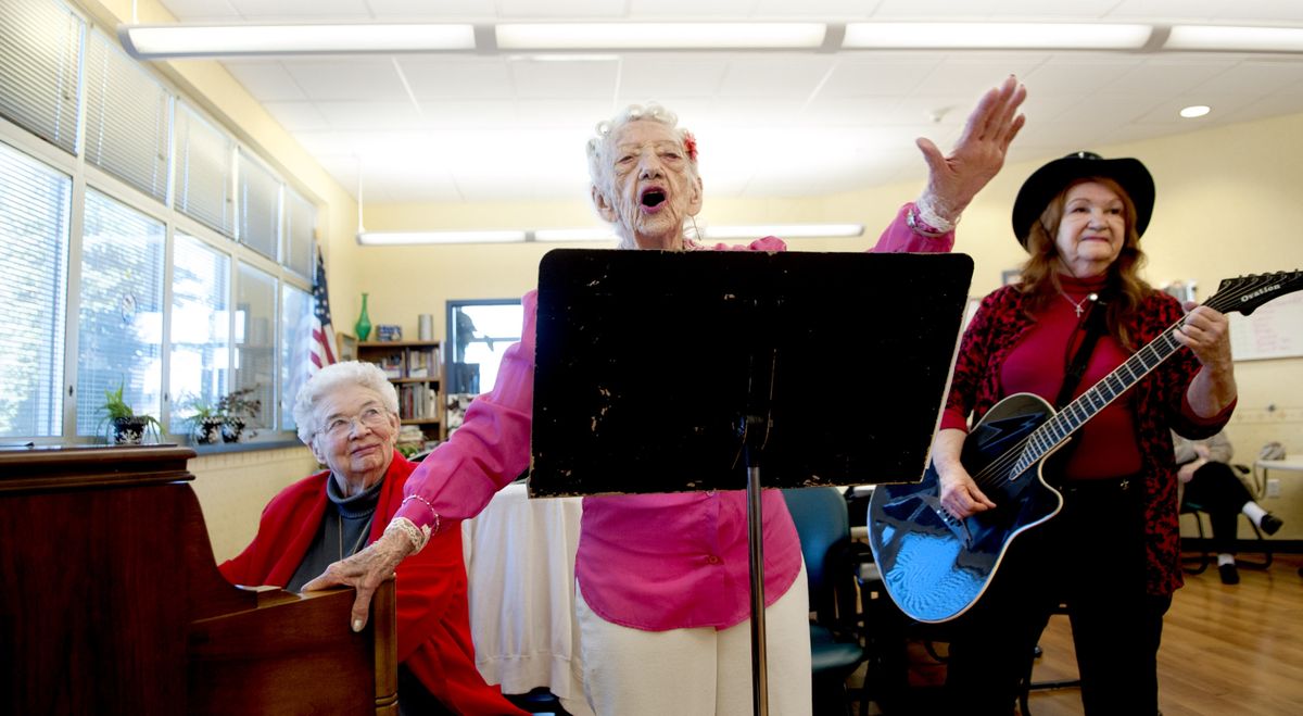“And I love you all,” said 101-year-old Betty Hollingsworth, as she finished singing for a small crowd at the McGrane Center’s Henry Heyn Adult Day Center during her birthday celebration in Coeur d’Alene on Friday. Playing the guitar for her is her daughter Iva Jane Smith and on piano is Kathryn Robison. (Kathy Plonka)