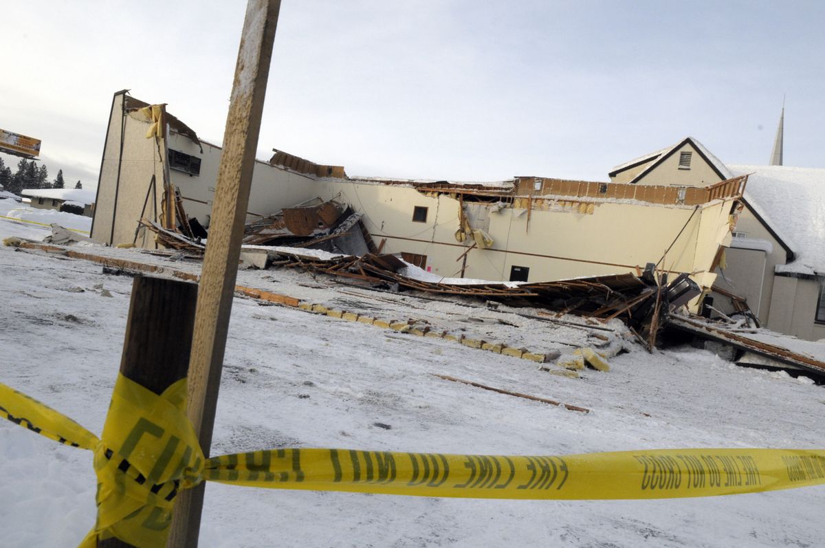 The roof caved in on Trinity Baptist Church’s gymnasium at 6528 N. Monroe St. early Tuesday.  (CHRISTOPHER ANDERSON / The Spokesman-Review)