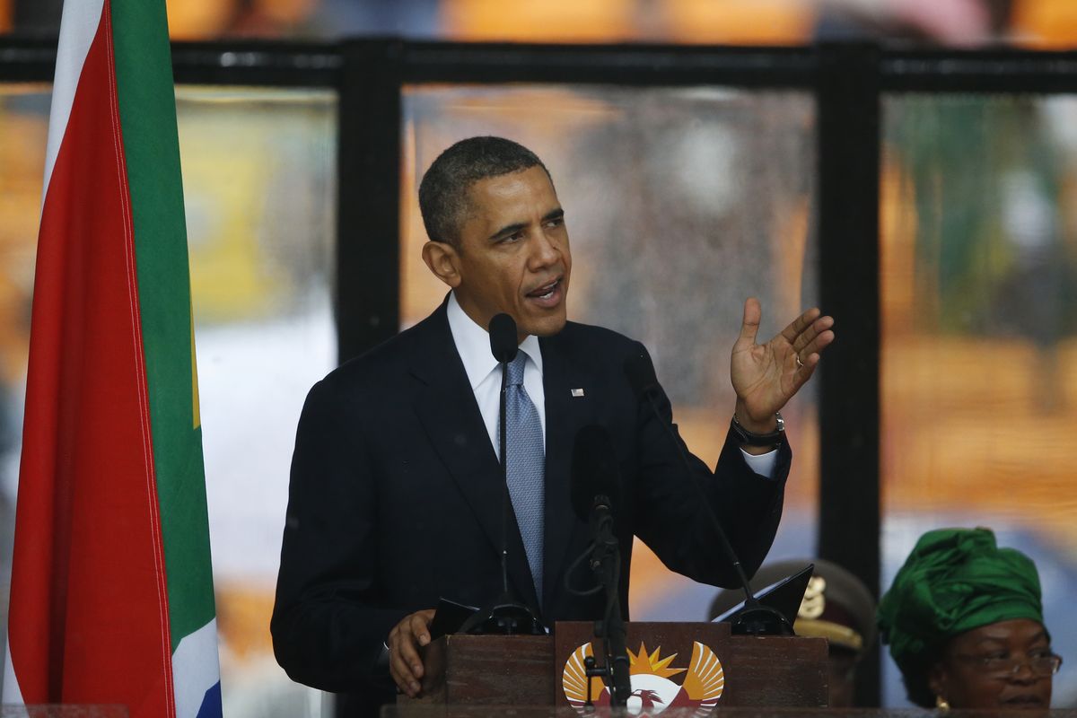President Barrack Obama speaks to crowds attending the memorial service for former South African president Nelson Mandela at the FNB Stadium in Soweto near Johannesburg, Tuesday, Dec. 10, 2013. (Matt Dunham / Associated Press)