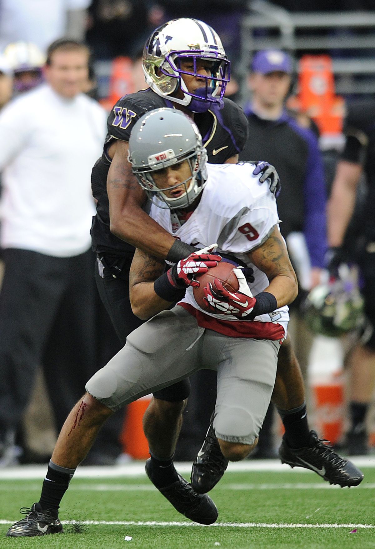 Washington State receiver Gabe Marks hauls in pass in front of a UW defender. (Tyler Tjomsland)