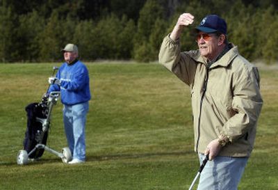 
Roger Almquist, right, watches his ball Monday at the second hole at Painted Hills Golf Course in Spokane Valley. It was  Almquist and Jerry Downie's first winter golf outing of the year.  
 (Liz Kishimoto / The Spokesman-Review)