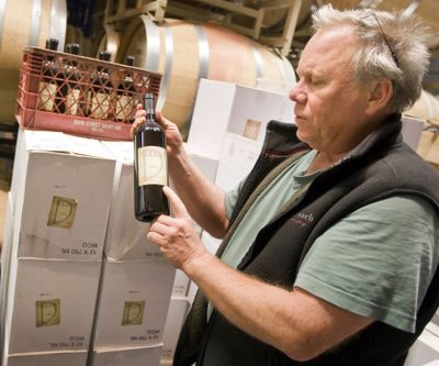 Robert Fuller, of Deodoro Cellars in Paso Robles, Calif., holds a bottle of his 2008 cabernet sauvignon while talking about the rules and regulations that govern wine labels.