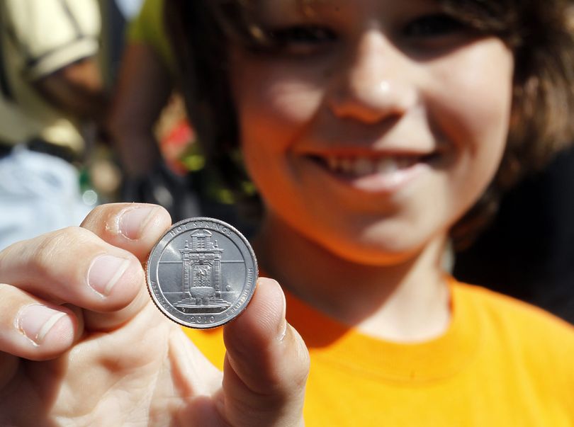 **COMMERCIAL IMAGE** In this photograph taken by AP Images for US Mint, Miles Brantley, 10, of Hot Springs, Ark., holds one of the America the Beautiful quarters honoring Hot Springs National Park, after a Ceremony in Hot Springs, launching the first coin in the America the Beautiful Quarters program, Tuesday, April 20, 2010. (Mike Wintroath / AP Images/ US Mint) (Mike Wintroath / Us Mint)