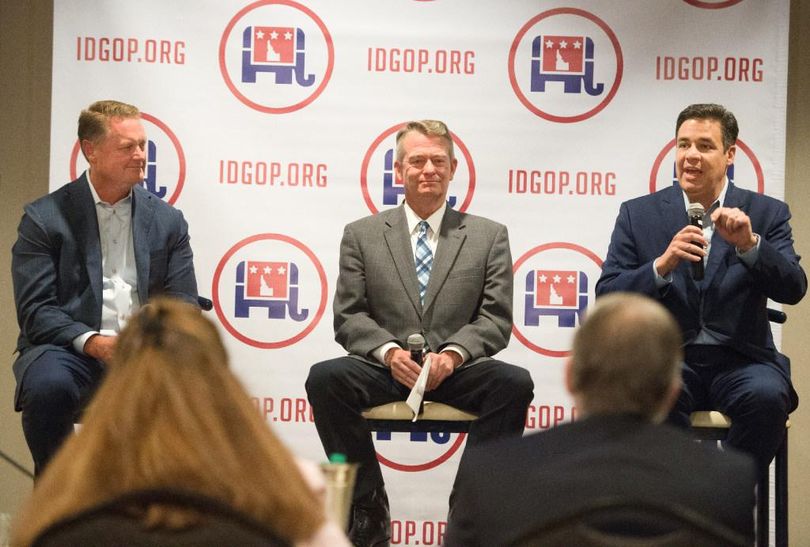 FILE – Idaho Rep. Raul Labrador, right, speaks as Lt. Gov. Brad Little, center, and Tommy Ahlquist, left, listen during an Idaho GOP forum for 2018 candidates for governor in Coeur d’Alene on July 21, 2017. All three are proposing major tax cuts as they seek the open Idaho governor’s seat in 2018. (Tyler Tjomsland / The Spokesman-Review)