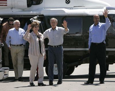 
President Bush waves with Louisiana Gov. Kathleen Blanco and New Orleans Mayor Ray Nagin, right, as he arrives in New Orleans on Thursday, visiting Hurricane Katrina rebuilding efforts. 
 (Associated Press / The Spokesman-Review)