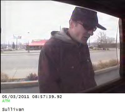 Police are asking for help in identifying a potential suspect in a residential burglary.
Surveillance photos at the Washington Trust Bank ATM on Sullivan Road in Spokane Valley captured images of a man in a black hat, dark glasses and jacket using the victim's credit card last Tuesday just before 9 a.m. 
The suspect arrived and left southbound on Sullivan on foot.
Anyone with information on the man's identity is asked to call Crime Check at (509) 456-2233 or Spokane Valley police Detective Mark Renz at (509) 477-3330. (Spokane Valley Police Department)