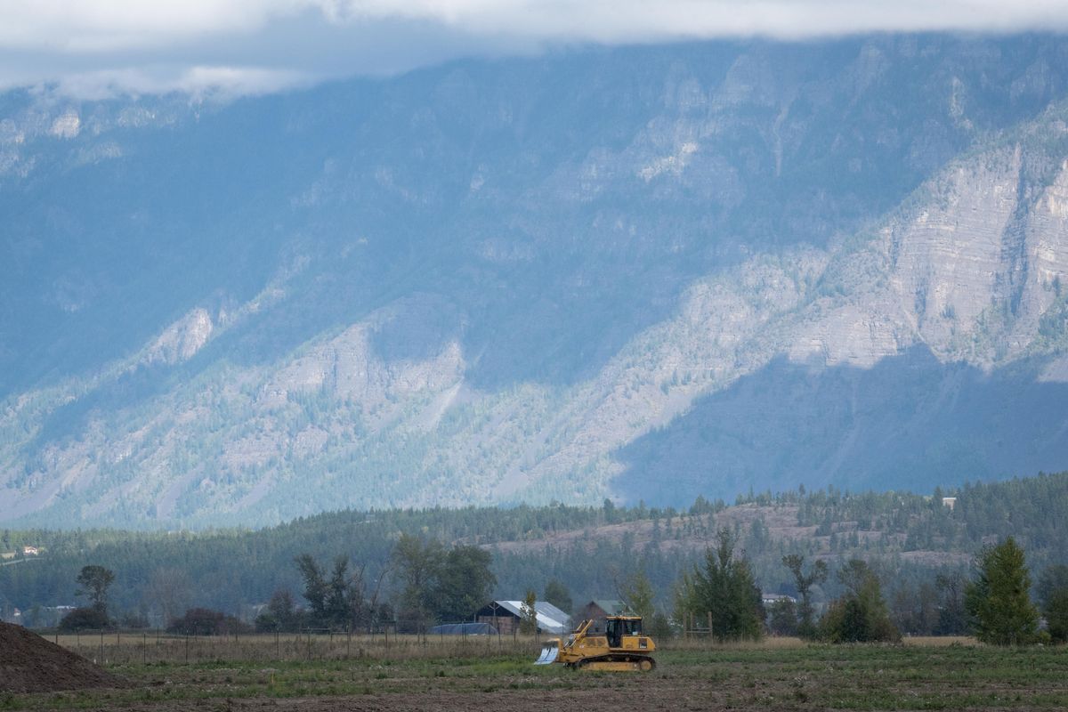 A tractor drives through an old farm field on Sept. 19, 2019. Idaho