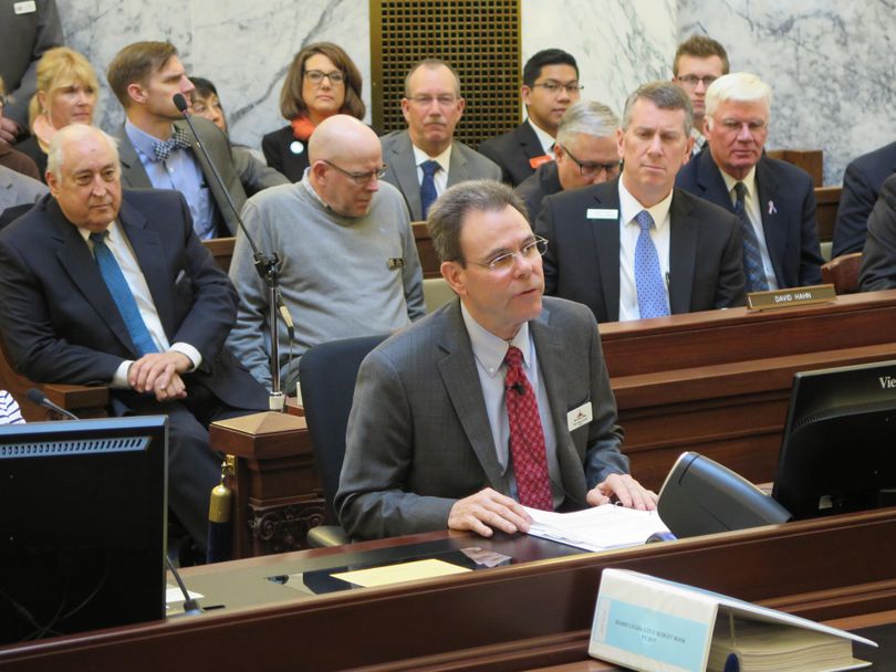 North Idaho College President Rick MacLennan makes his budget pitch to the Idaho Legislature’s joint budget committee on Monday, Jan. 22, 2018. At right is Division of Financial Management budget analyst David Hahn; at left, College of Western Idaho President Bert Glandon. (Betsy Z. Russell / SR)