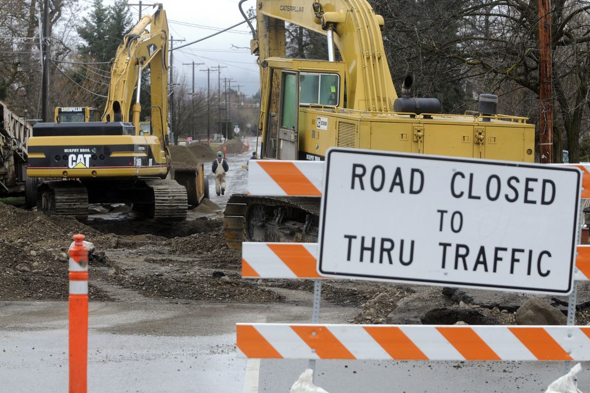 Among construction projects in Spokane Valley, work has started again on the Barker Road sewer project at Laberry Drive in Greenacres. (J. Bart Rayniak)