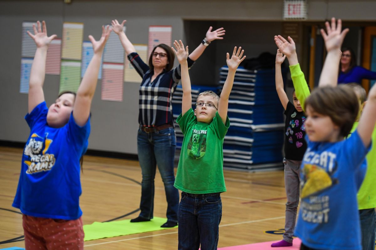 Regal Elementary School Principal Tricia Kannberg joins fourth-graders during mindfulness instruction, Friday, Feb. 22, 2019. (Dan Pelle / The Spokesman-Review)