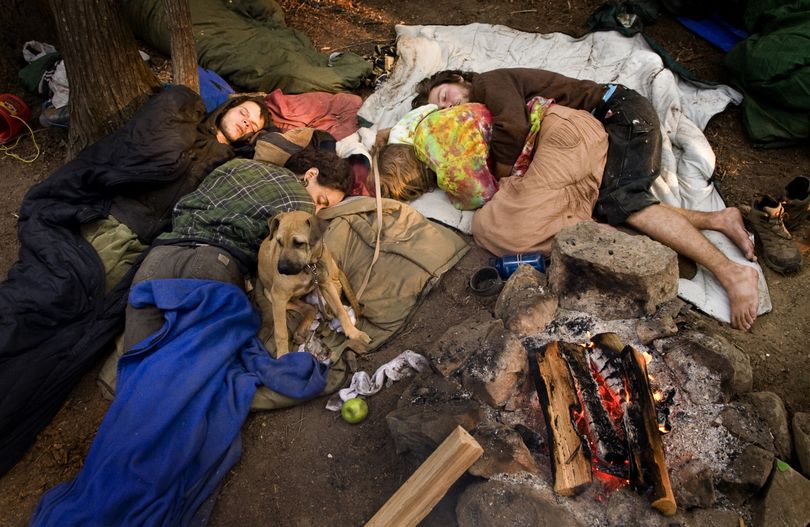 With cool nights in the Colville National Forest, many Rainbow Family followers sleep communally around campfires. About 300 Rainbows are attending this regional gathering, but a national gathering next year could attract thousands to a Washington state forest. (Colin Mulvany / The Spokesman-Review)