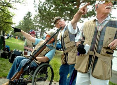 
Ernie Butler, left, Mike Davis, center, and Ron Young  talk about wind direction before a shoot at the Spokane Gun Club on Thursday. Nearly 500 shooters from as far away as Alaska and California are expected at the 2006 Inland Empire Handicap, which runs through Sunday.
 (Photos by JOE BARRENTINE / The Spokesman-Review)
