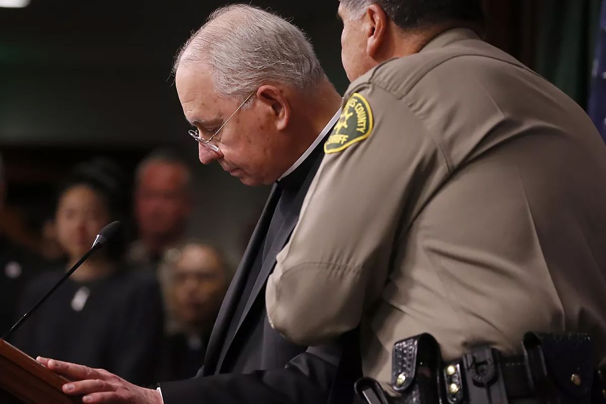 L.A. County Sheriff Robert Luna comforts Los Angeles Archbishop José H. Gómez during a news conference regarding the slain Auxiliary Bishop David G. O'Connell, whom Gómez called “a good friend” of the city.    (Luis Sinco/Los Angeles Times/TNS)